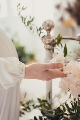 bride holding wedding decorations and flowers