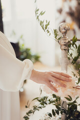 bride holding wedding decorations and flowers