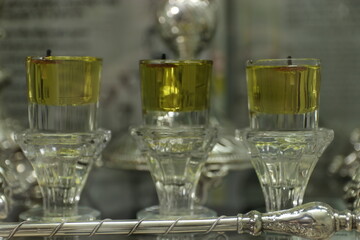 Shabbat candles are lit with oil in silver candlesticks. Orthodox Jewish custom on Saturday night before sunset.