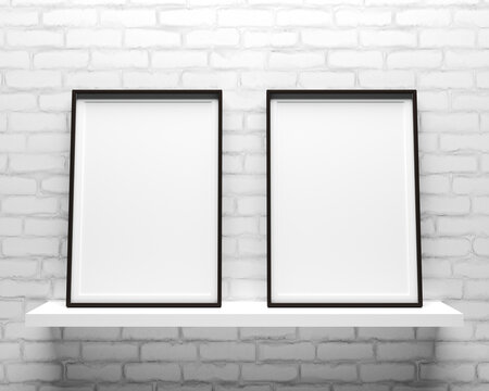Elegant and minimalistic two picture frames standing on gray wall