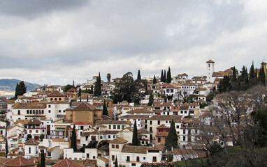 Fototapeta premium Horizontal frame of Albaicín and Sacromonte area during a cloudy day of winter in Granada. 