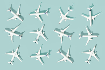 Creative composition made with passenger plane on blue background. Summer travel or vacation...