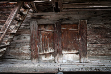 old wooden door of an traditional Swiss mountain barn