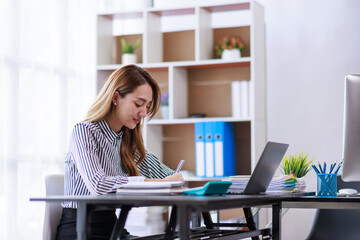 Modern Asian business woman in the home office, doing planning analyzing the financial report, business plan investment, finance analysis concept