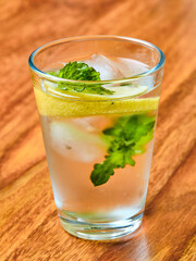 Summer drink with lemon, mint and ice