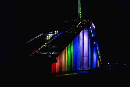 Vehicles cross rainbow bridge