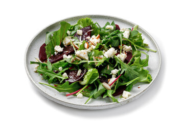 Healthy vegetarian salad, leaves mix salad micro greens, beet, feta cheese, nuts. Meal snack outdoor copy space for text. Isolated on white background.