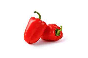 Two Red sweet mini peppers, paprika isolated on a white background. Heap, group, set of mini bell peppers. Vegan diet food.