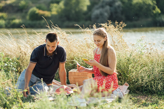 Social media internet addiction, phubbing. Young couple reading social media on their smart phones while having dating