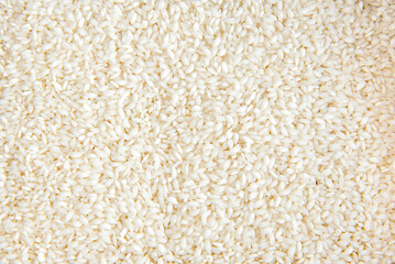 Arborio rice or risotto rice texture background top view.