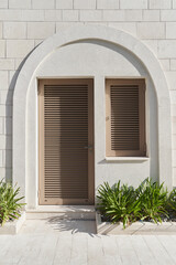 Building entrance with shutter doors and window