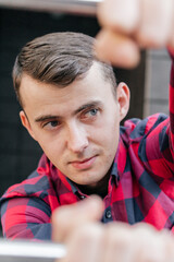 Portrait of a guy in a red checkered shirt