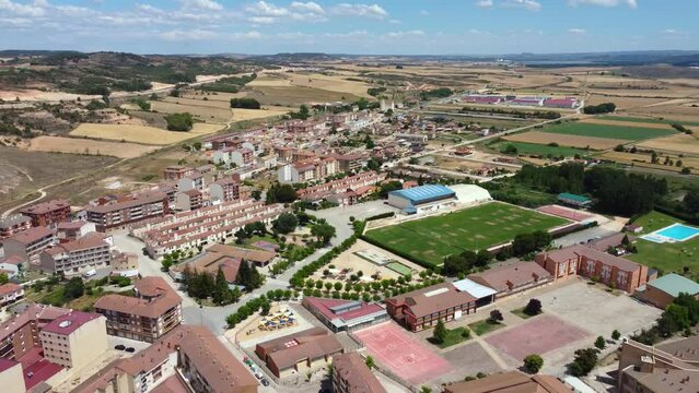 Aerial cinematic perspective of San Esteban de Gormaz situated in province of Soria - Spain. River Duerdo crossing the city. Beautiful architecture with small streets and houses built in the mountains
