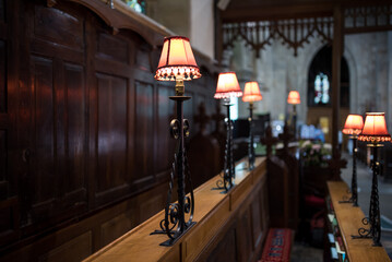 Lamps at the benches for the church choir.