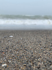 Sad sandy seashore in the evening close-up