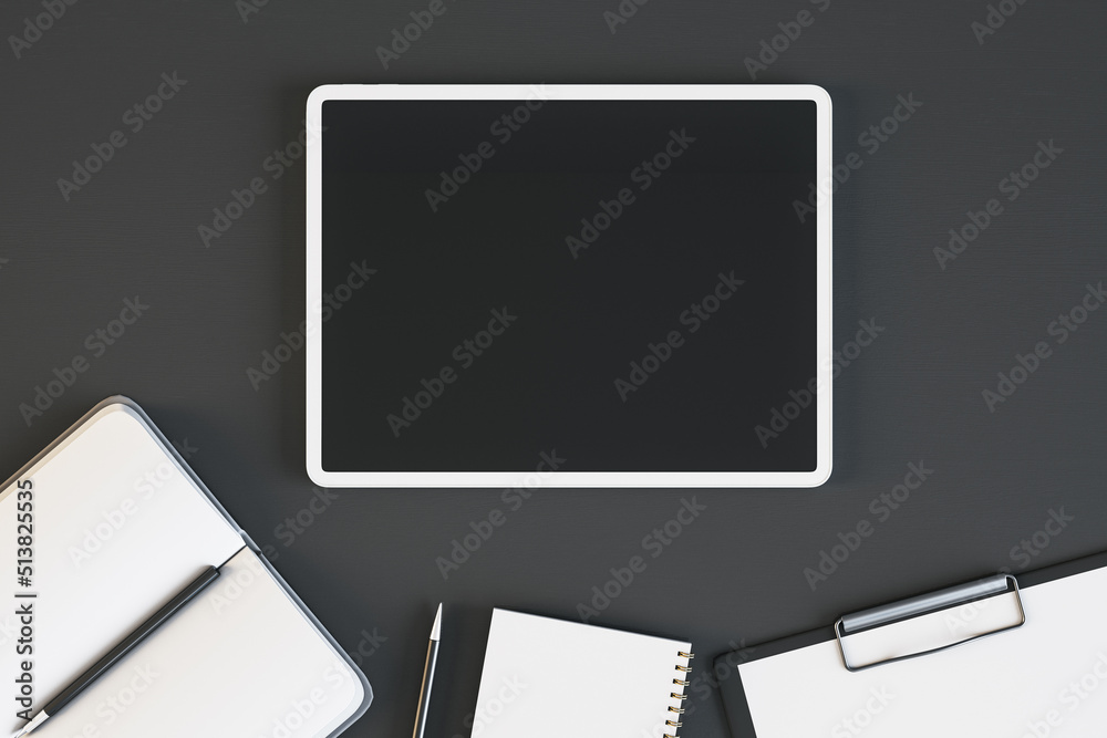 Poster Top view and close up of empty tablet on black desktop with supplies. Work place and stationery objects concept. Mock up, 3D Rendering.