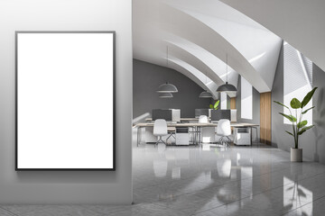 Front view on blank white poster with space for your logo or text on light grey wall in sunlit spacious coworking office with cozy work places, grey glossy floor and green plant. 3D rendering, mock up