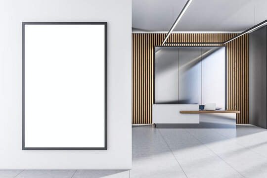 Front view on blank white poster with place for your logo or text on light wall in sunlit spacious office on modern eco style reception desk background. 3D rendering, mock up