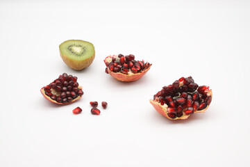Pieces of cut pomegranate and kiwi fruit.