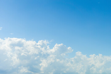 Blurred abstract cloud background. Cumulus clouds move into a clear sky.
