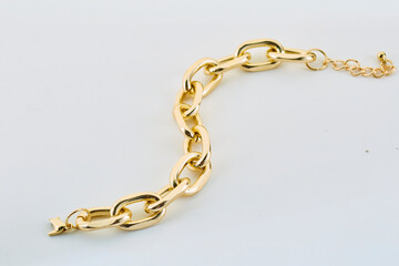 Gold chain. ring gold chain gray background