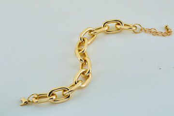Gold chain. ring gold chain gray background