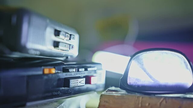 Dolly Shot Of An Old Dusty Cassette Recorder In The Garage With Glasses.