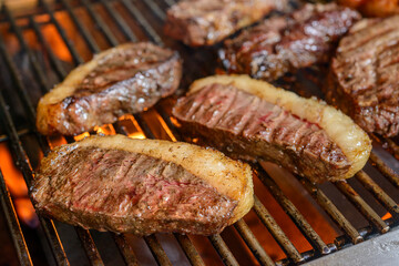 Picanha barbecue with blurred background. This form of barbecue is widely consumed throughout...