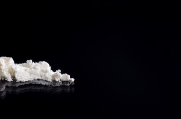 White drug on a black background