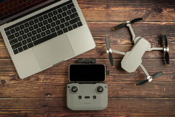 mobile phone attached with the drone controller for to-view filming and photography. gear concept.