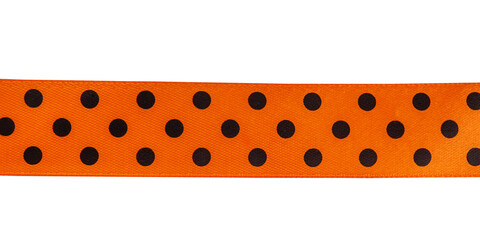 Orange ribbon with black peas isolated on a bill background. Halloween concept.