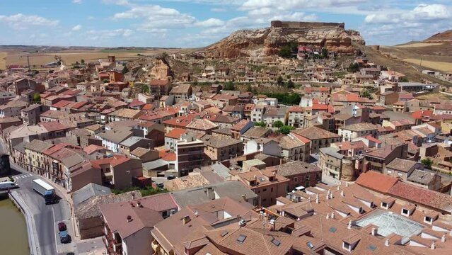 Beautiful city San Esteban de Gormaz situated in province of Soria - Spain. Aerial view of the city and the river Duerdo. The town is located in the Wool Route and the Way of the Cid. Drone descending