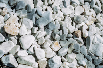 construction of big round garden Alpine slide with stones and dwarf conifers and circular walking path.