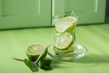 tea with mint and lime, with a calming effect, green still life close-up 