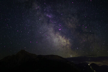 Fototapeta na wymiar nightscape, night full of stars, view at the mountain Hoher Goell, Berchtesgaden, Bavaria, Germany, and the Milkyway behind in the night sky