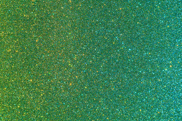 Background with sparkles. Backdrop with glitter. Shiny textured surface. Dark moderate lime green