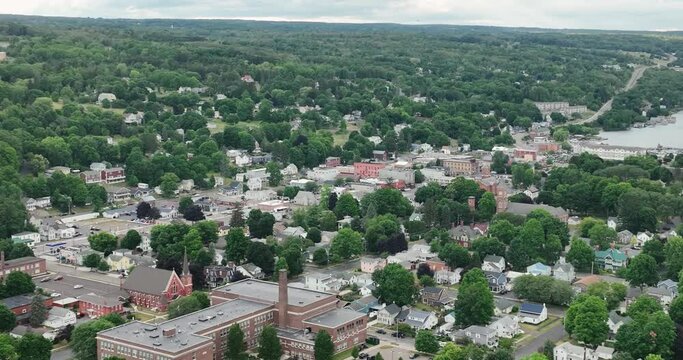 Aerial drone video of streets and buildings of Watkins Glen Village NY USA in summer season, green trees, gorge, Seneca Lake.
