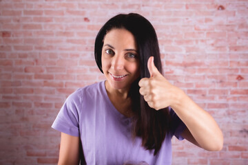 woman with many expression and gestures thumb's up 