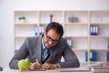 Young male employee in planning retirement concept