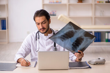 Young male doctor radiologist working in the clinic