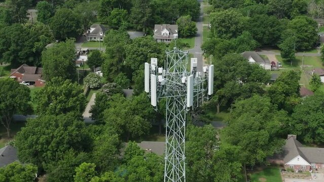 Close Up Of Drone Flying Directly Over Cell Phone Tower.