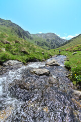 Landscape of creek in the mountains in Andorra during summer