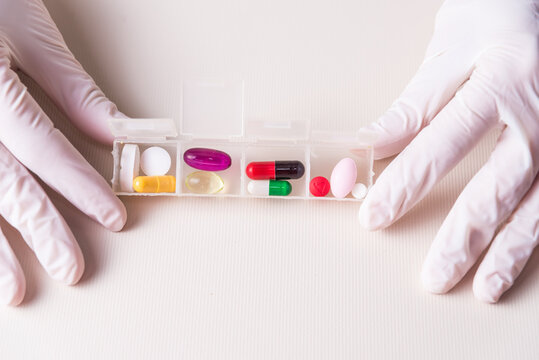 medical indications, hands showing colored pills, medicinal, pandemic, health and wellness concept