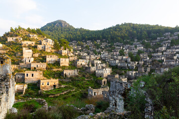 Fototapeta na wymiar Aerial view of ancient Greek ruined Kayakoy village, preserved as museum village and ghost settlement in Mugla Province of Turkey