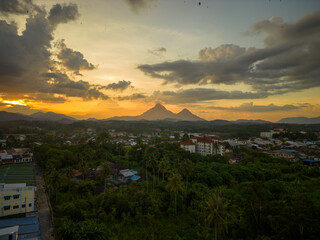 An aerial view of sunset in the sleepy town with a twin peak in the background