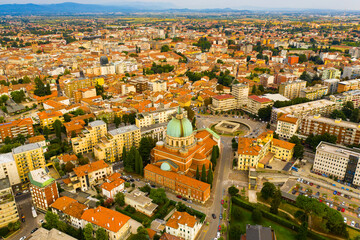 Aerial view of Udine cityscape overlooking residential areas and ossuary temple of Fallen of Italy...