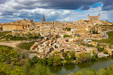 Fototapeta na wymiar Cityscape of Toledo view of Alcazar and Tagus River. Castilla-La Mancha, Spain.