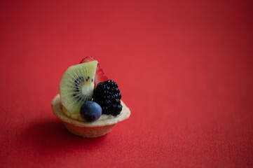 fruit tart on red background