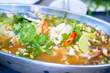 sour and spicy steamed squid with lemon