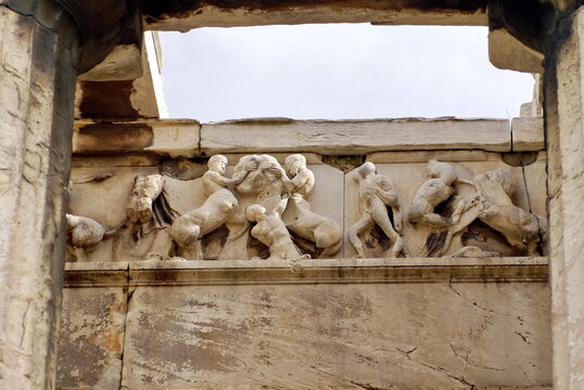 Bas relief carving on a lintel in an ancient temple in Athens, Greece